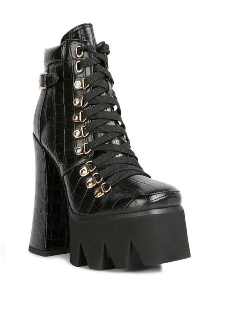 Black platform lace up biker boots with chunky block heel and metal eyelets"