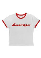 Shop the Roadtripper cropped ringer tee, a retro 70s inspired white baby tee with red trim and vintage travel graphic. Perfect for road trips, festivals, and casual outfits.