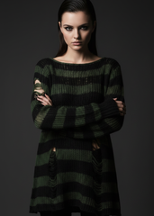 omen’s oversized distressed knit sweater with black and dark green stripes, long sleeves, ripped details and wide boat neckline.