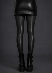 Black high shine tights styled with gothic corset dress and platform boots

