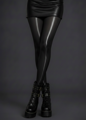 Close-up of black glossy high shine tights showing silk-look finish
