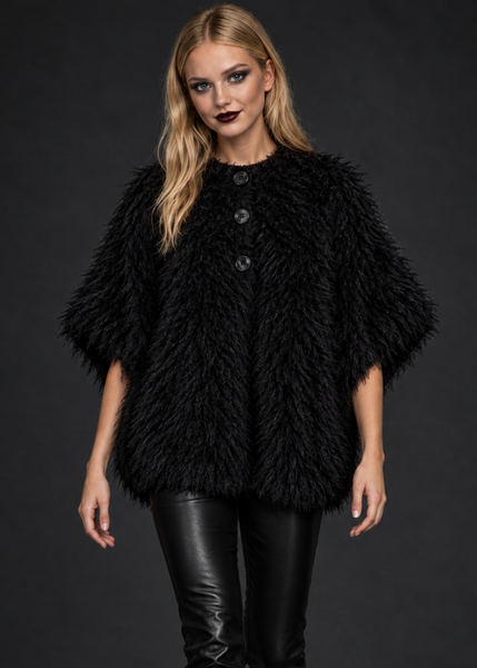 Model in an oversized black shaggy poncho cape coat with short sleeves and front buttons by Pretty Attitude alternative rock fashion outerwear