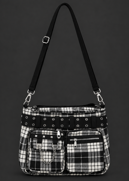 Front view of a black and white plaid punk handbag with an eyelet belt, studded front pocket, silver chain and adjustable shoulder strap