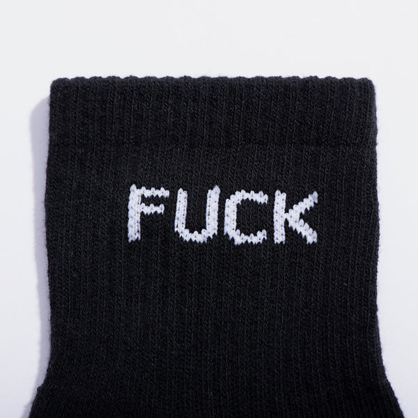 Black sock with white text on a light gray background