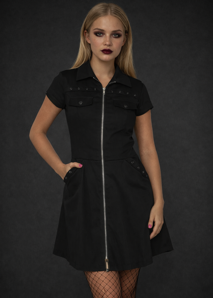 Black gothic zip front mini dress with A-line silhouette styled with fishnet tights, dark academia alternative punk goth fashion dress for women.