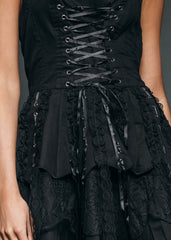 Alternative fashion mini dress – gothic halter style with corset lacing and delicate lace accents.





