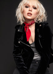 "Women’s black velvet moto jacket with asymmetrical zipper, gothic biker style outerwear for alternative fashion and concert outfits.