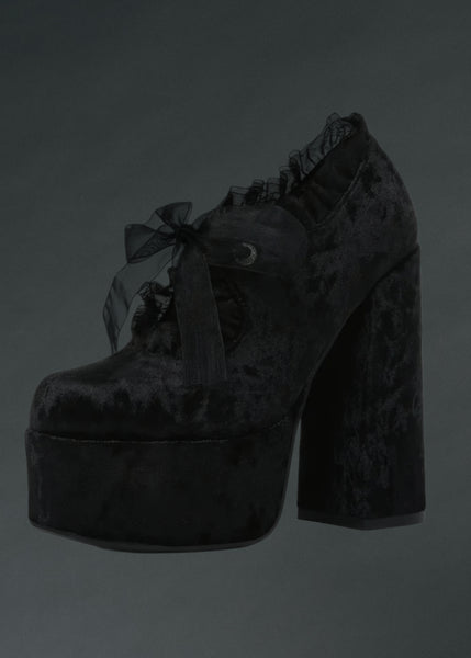 Black platform shoes with ruffles and a bow on a dark background goth lace up velvet 