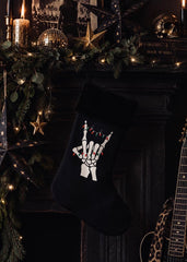 Black Christmas stocking with skeleton hand design and black faux fur trim