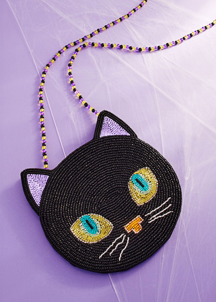 Black cat-shaped beaded purse on a purple background goth black Halloween witch 
