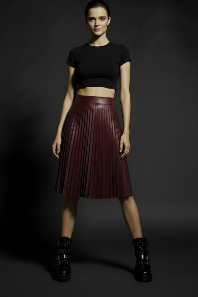 Burgundy pleated faux leather midi skirt with high waist and flowing A-line silhouette