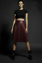 Burgundy pleated faux leather midi skirt with high waist and flowing A-line silhouette