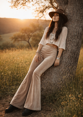Neutral taupe velvet bell bottoms for women featuring a fitted upper leg, wide flare hem and retro festival style