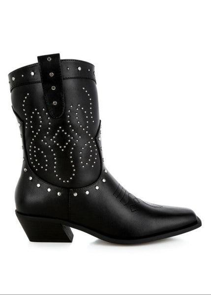 Black cowboy boots with studded details on a white background