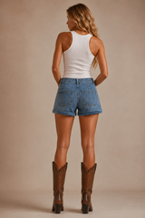 Star Muse Shorts – back view showing cuffed hem, double back pockets and light wash denim, styled with white tank top and brown cowboy boots