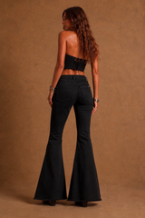 Copper suede panel detail on black bell bottom flare jeans
