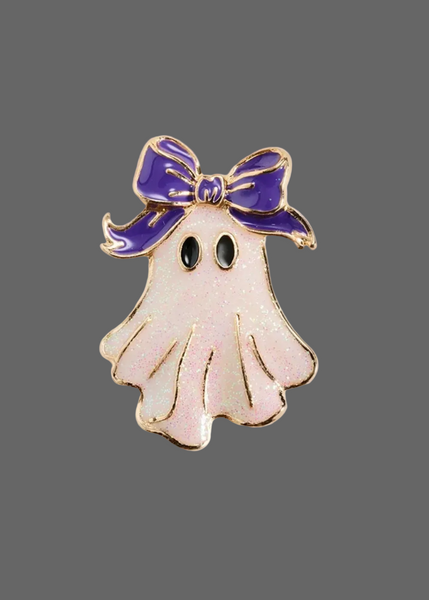 Whimsical ghost-shaped Halloween pin brooch with an oversized bow and sparkling accents for jackets, bags, or costumes