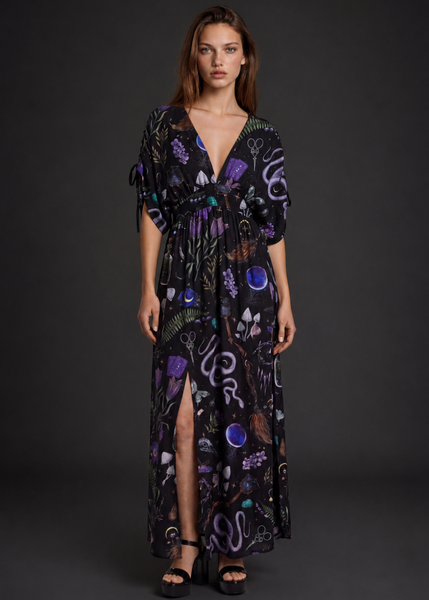 Witchy Forest Maxi Dress in purple – deep V-neck, empire waist, side slit, mushroom and snake print on black, worn by model