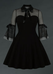 Black dress with sheer sleeves on a dark background wednesday collar velvet 