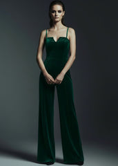 Emerald green velvet spaghetti strap jumpsuit with wide leg pants full body front view