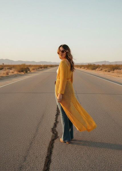 Close-up of self-tie waist belt on yellow open-weave crochet kimono duster
