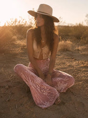 Festival velvet flare pants in blush pink – styled outfit