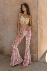 Women's crushed velvet bell bottoms in light pink – detail shot