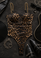 Leopard print bustier bodysuit with gold chain straps - side profile view on model with black ankle boots