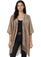 Woman wearing leopard print kimono over black outfit - festival fashion styling