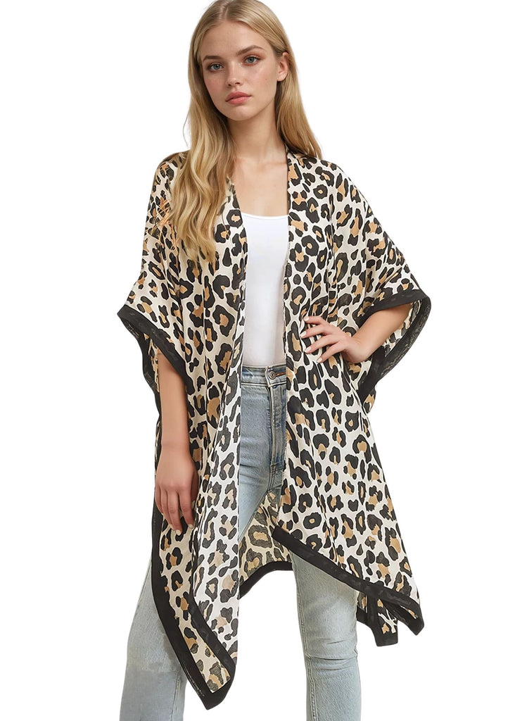 Women's leopard print kimono with lightweight flowy fabric, open front design and bohemian style — perfect for layering or as an animal print estival outfit.