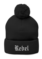 Black beanie with pom-pom and 'Rebel' embroidery on a white background