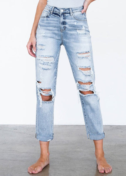 High waist destroyed girlfriend jeans in light wash – front view
