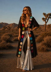 Silver ruffled bell bottom pants styled for night out — disco glam metallic flare trousers
