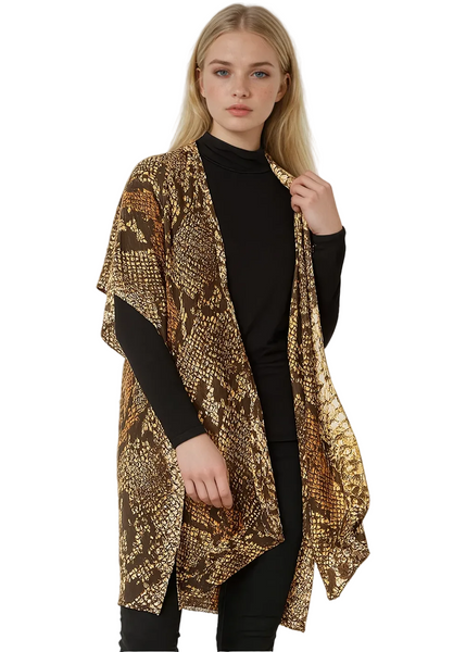 Woman wearing a patterned gold and brown scarf festival boho rocker concert outfit 