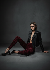 model seated on floor, leather jacket Model sitting in burgundy velvet burnout leggings and black leather jacket, Pretty Attitude editorial shot

