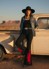 Black cowgirl flare pants with red flame accents and stud trim, alternative rock fashion bell bottoms for women