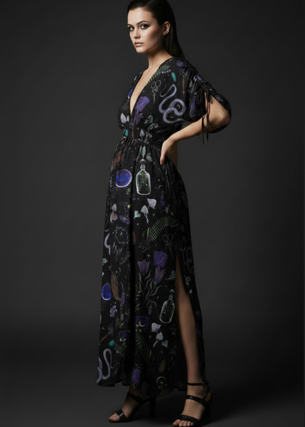 Women’s black gothic maxi dress with witchy occult print, deep V neckline, side slit and flowing boho silhouette