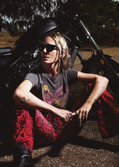 red snakeskin flare pants